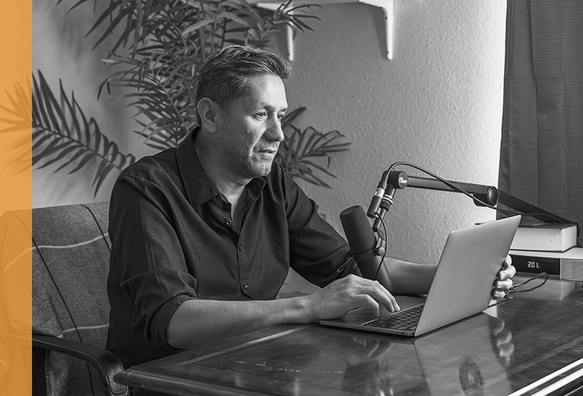 Elias, an adult man living with becker muscular dystrophy, podcasting