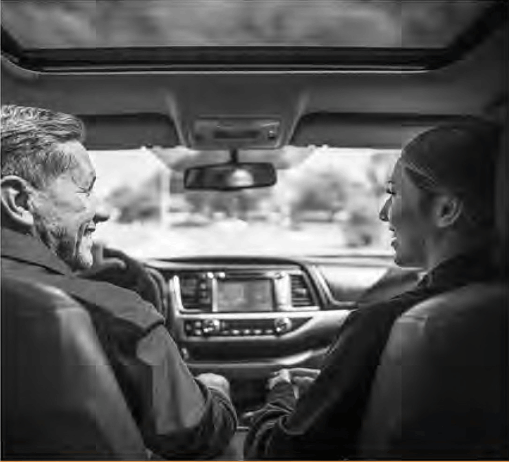 Elias, an adult man living with becker muscular dystrophy, driving his car